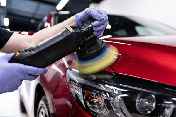 Dual action polisher on car panel